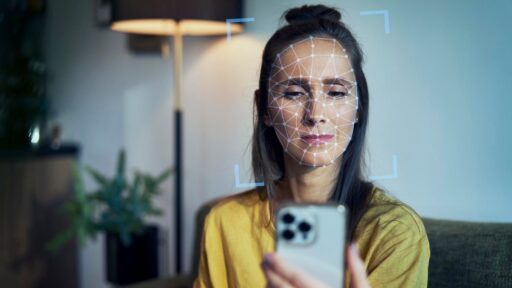 A young women using phone with face recognition