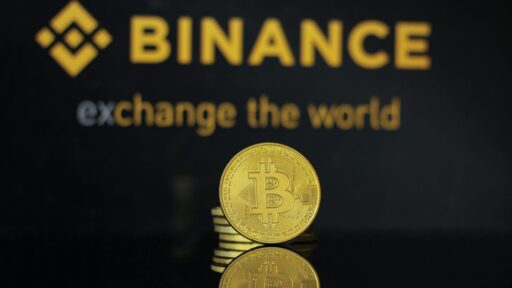 Closeup of bitcoin coin with binance logo
