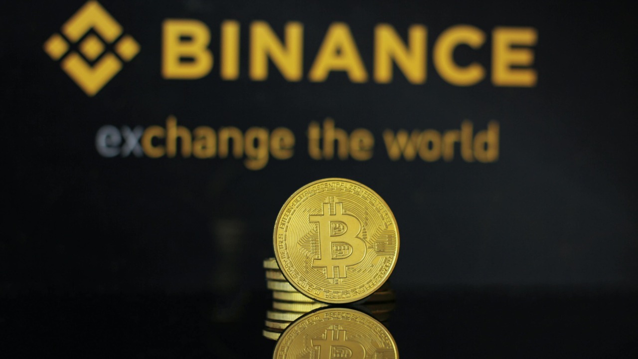Closeup of bitcoin coin with binance logo
