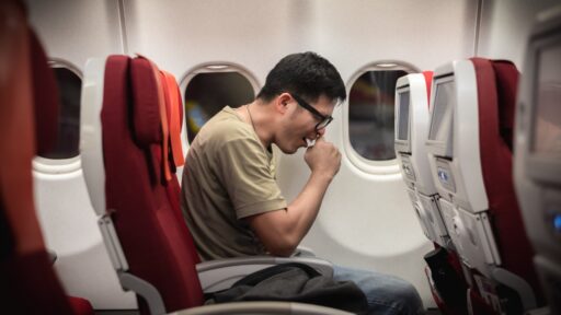 man get sick during travel on aeroplane