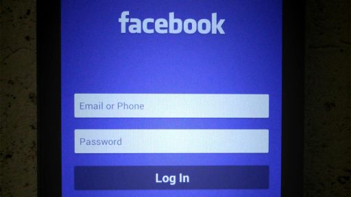 a black smartphone showing login page on mobile