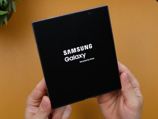 a person holding black box with samsung logo