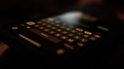 black qwerty phone turn on in dark room