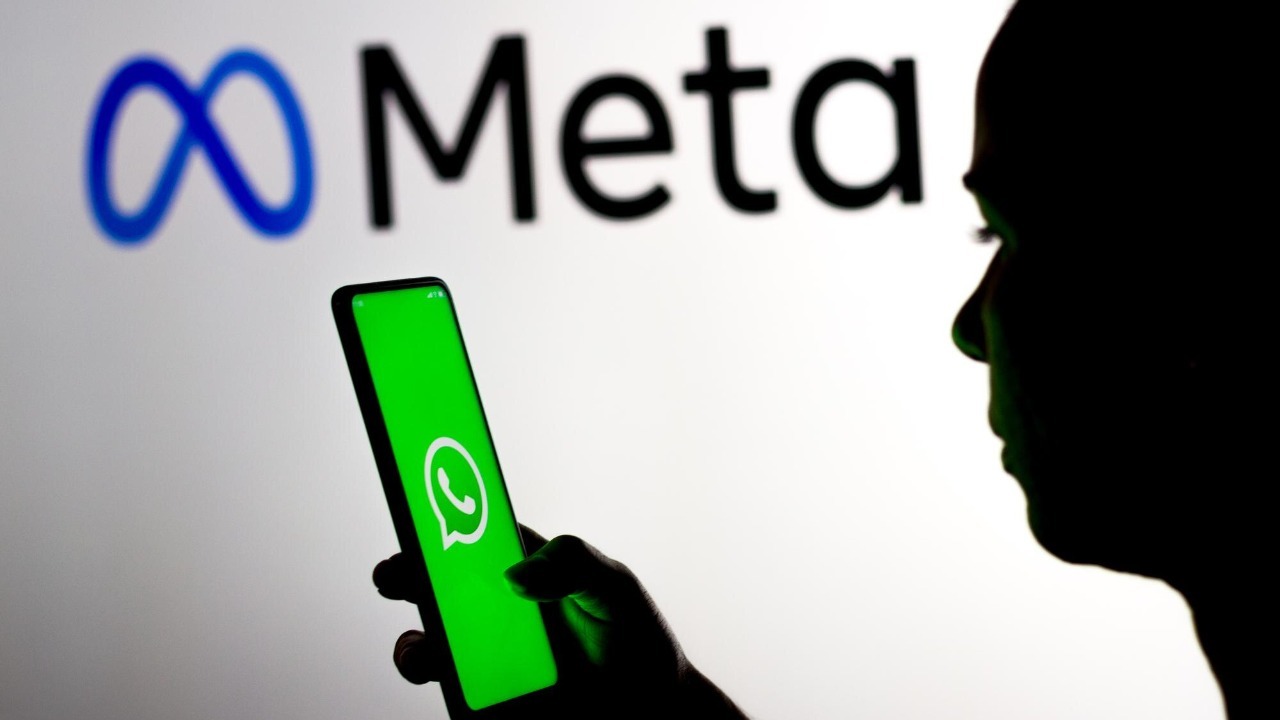 women holding phone opening whatsapp app