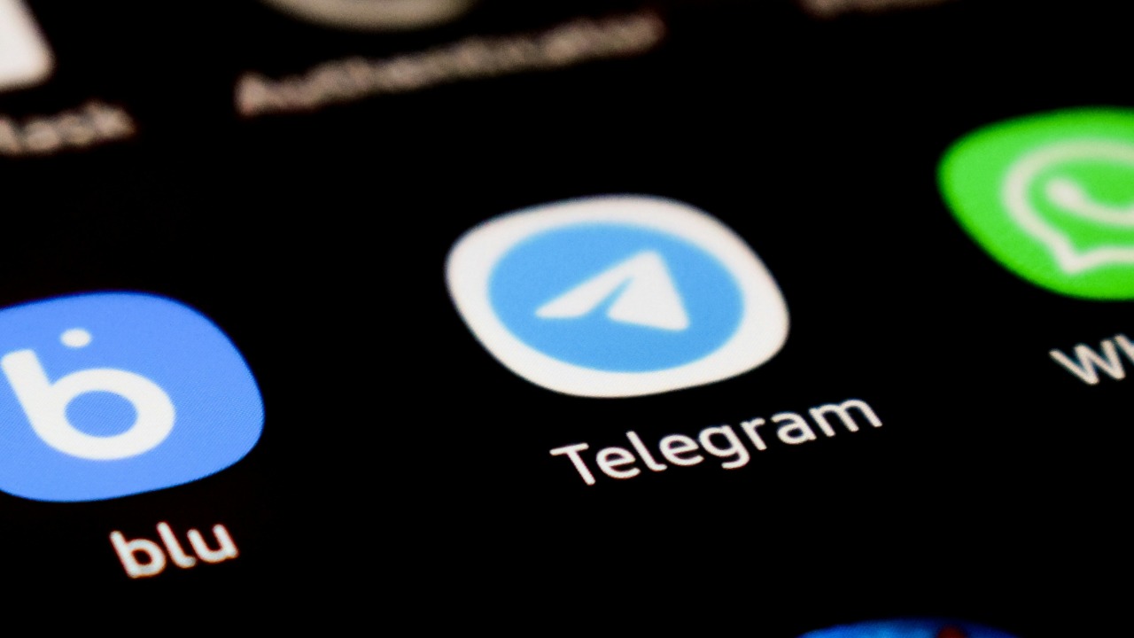 a closeup of cell phone showing Telegram app
